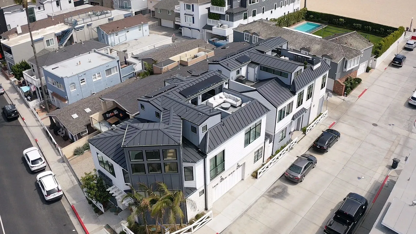 Drone overhead of a Newport Beach residence with standing seam metal roof