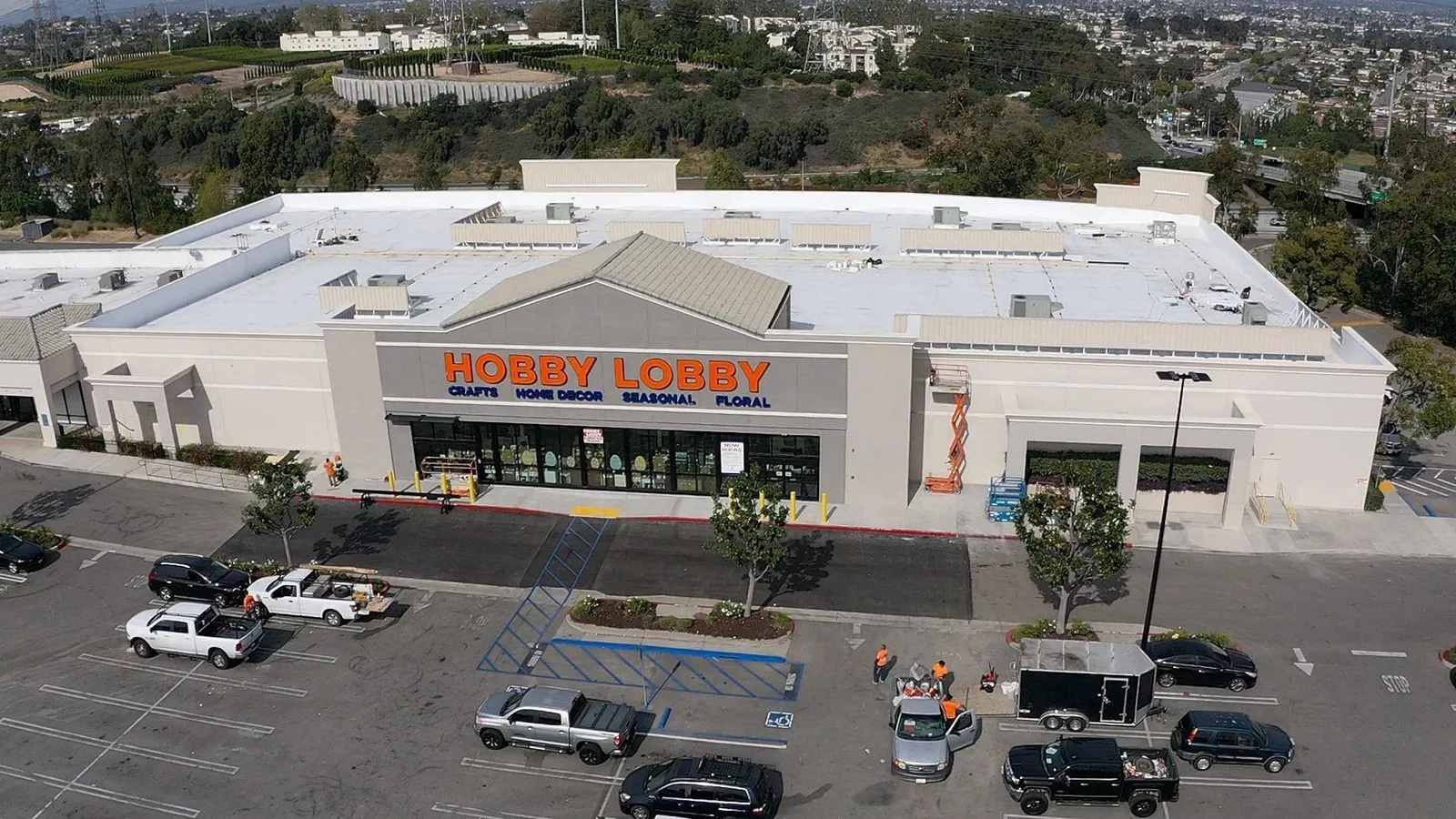 Hobby Lobby retail building with completed white low-slope roof