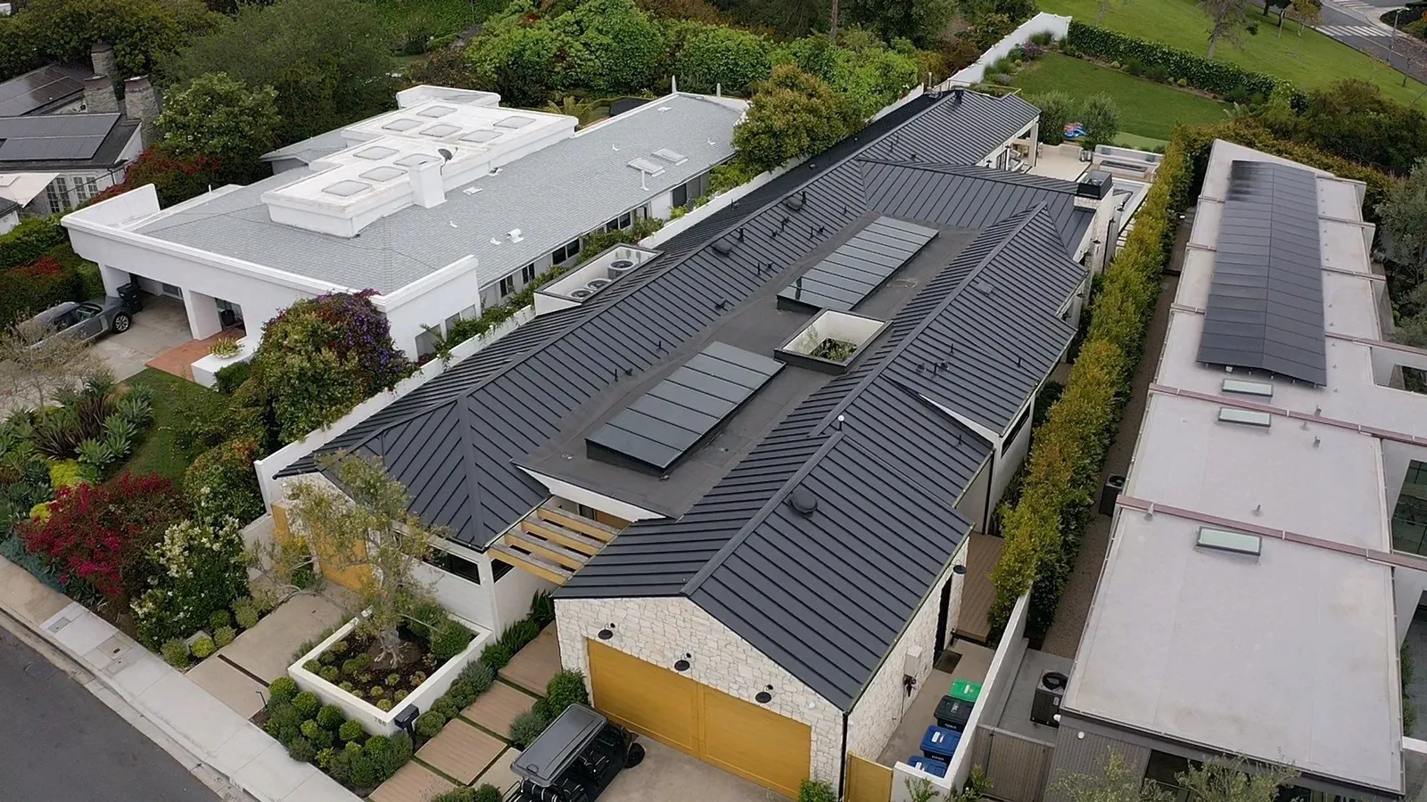 Overhead drone view of a new standing seam metal roof on a Corona del Mar home