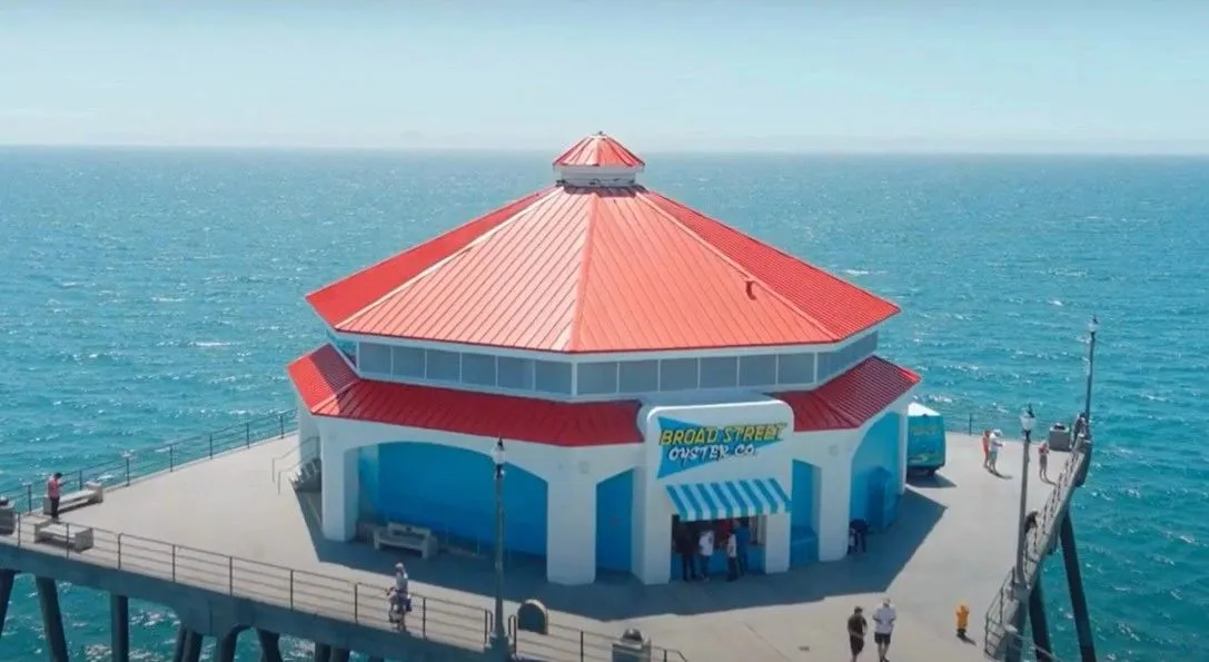 Red standing seam metal roof on the octagonal building at the end of the Huntington Beach pier