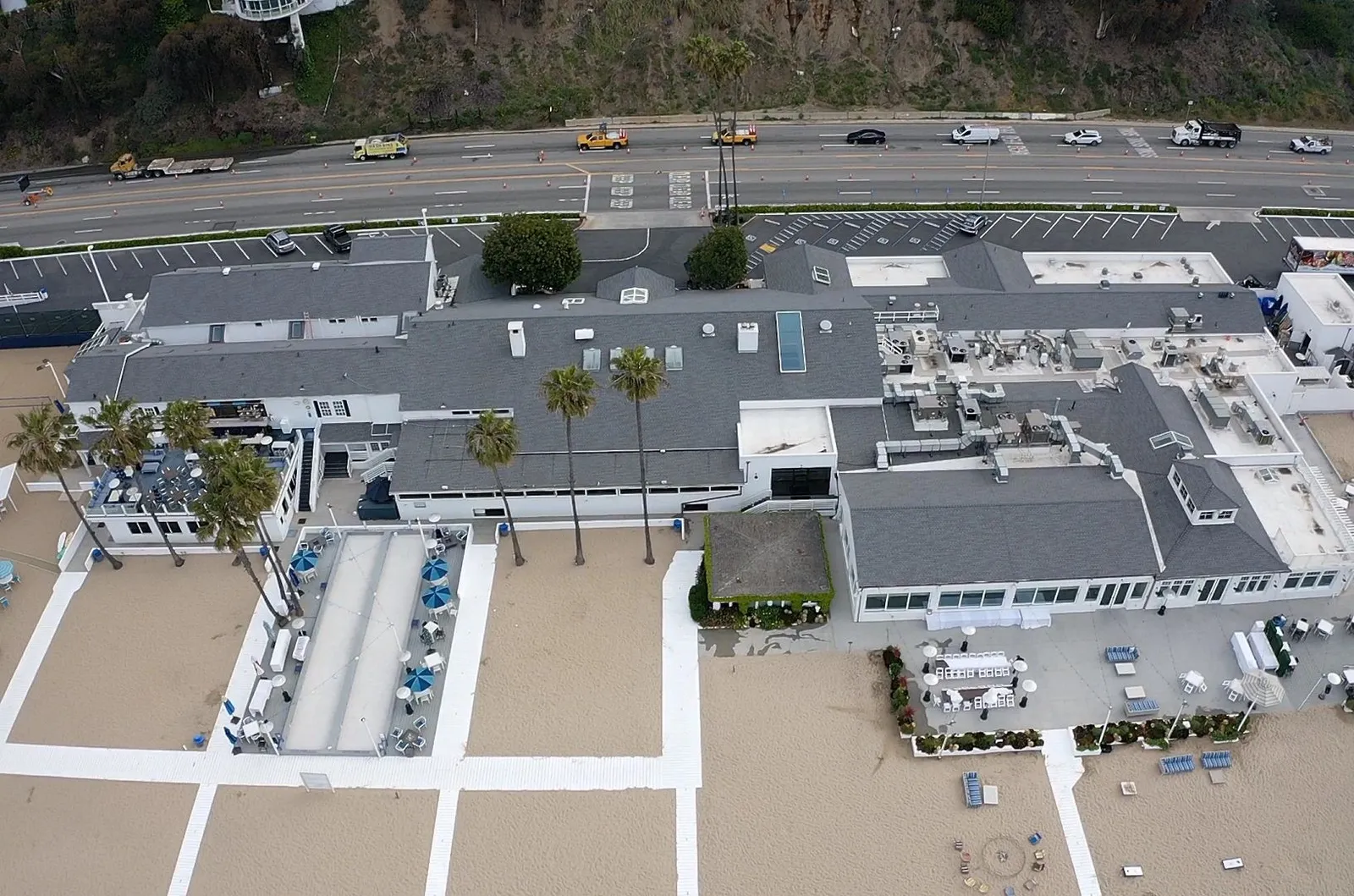 Overhead view of asphalt shingle and white single-ply TPO roofs at the Santa Monica Beach Club